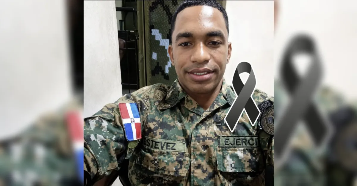 Dominican Army soldier in camouflage with Estevez name patch and Dominican flag patch, smiling, gray awareness ribbon overlay.
