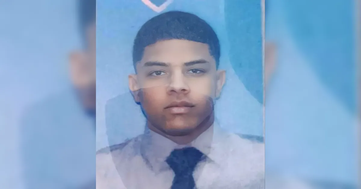 Double-exposed portrait of a young man in a light shirt and dark tie, looking straight ahead against a bluish background.