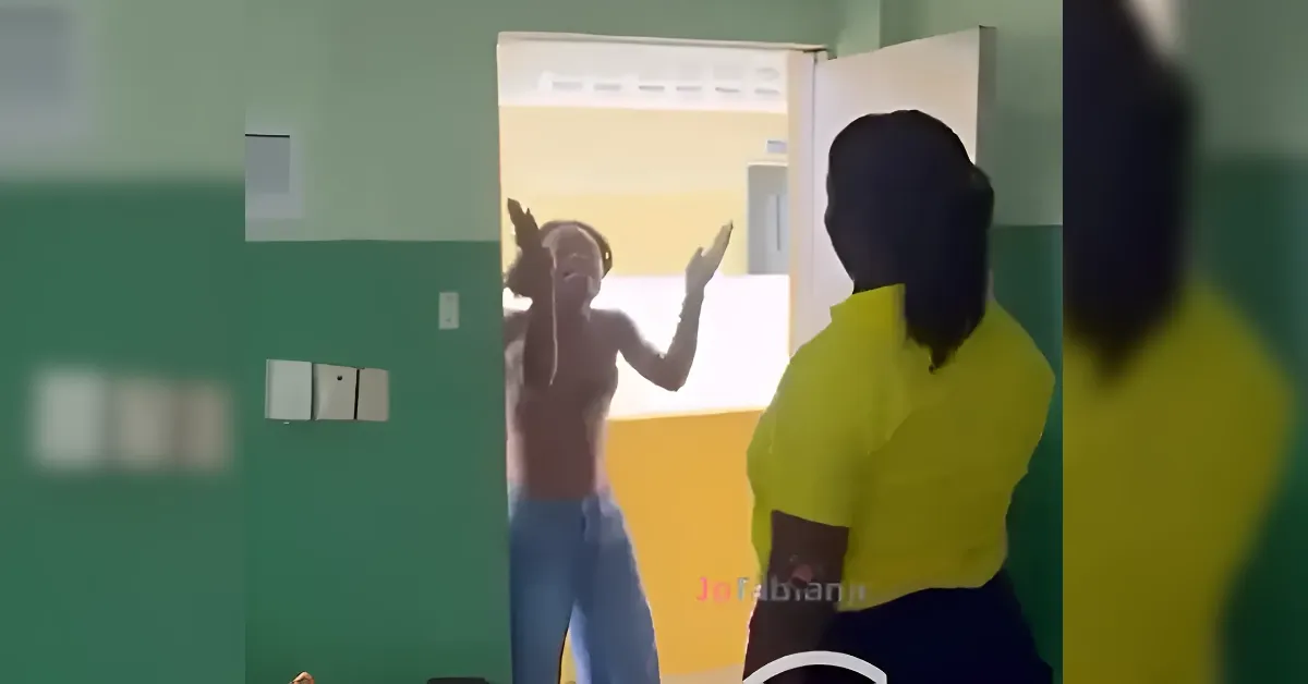 A shirtless person raises hands at an open doorway toward a person in a yellow shirt inside a green-walled room.
