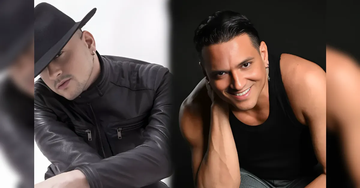 Two men pose together: left man in a black leather jacket and fedora tilts his head, right man in a black tank top smiles.
