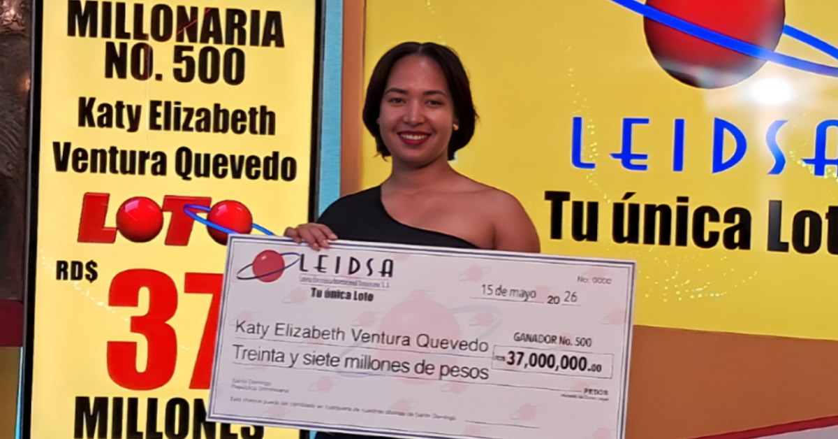 Smiling woman holding a large lottery check for 37,000,000 pesos in front of a bright yellow lottery banner.