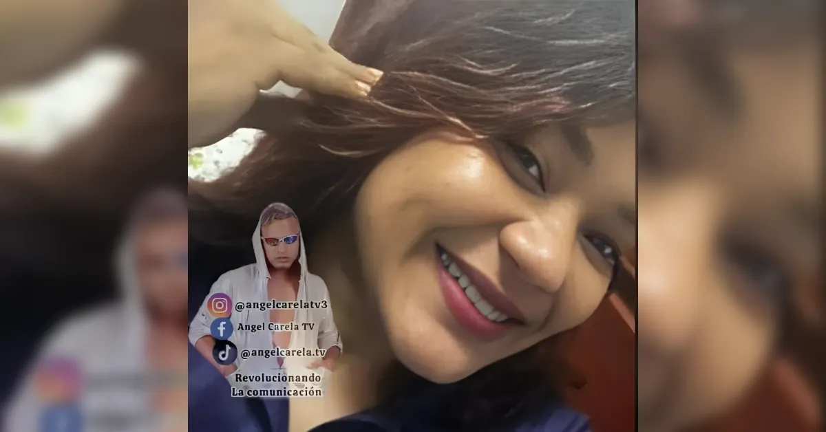 Smiling woman tilting her head with hand in her hair, in a vertical video frame with a small hoodie-wearing figure and social media handles overlayed in the corner.