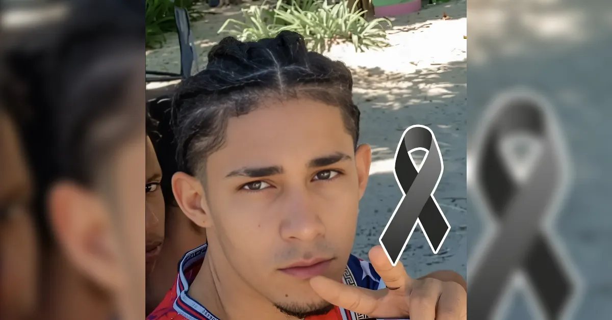 Selfie of a young man with a black/gray awareness ribbon symbol indicating remembrance or support for a cause on the image.