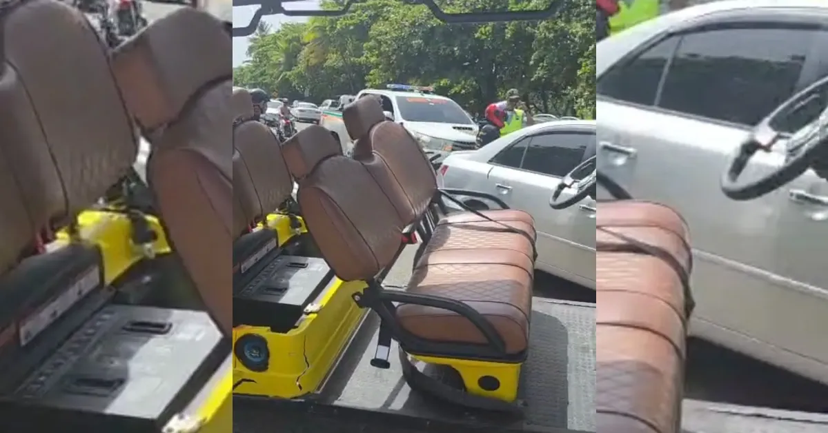 Yellow utility vehicle interior with two rows of brown leather seats, parked on a street with cars nearby.