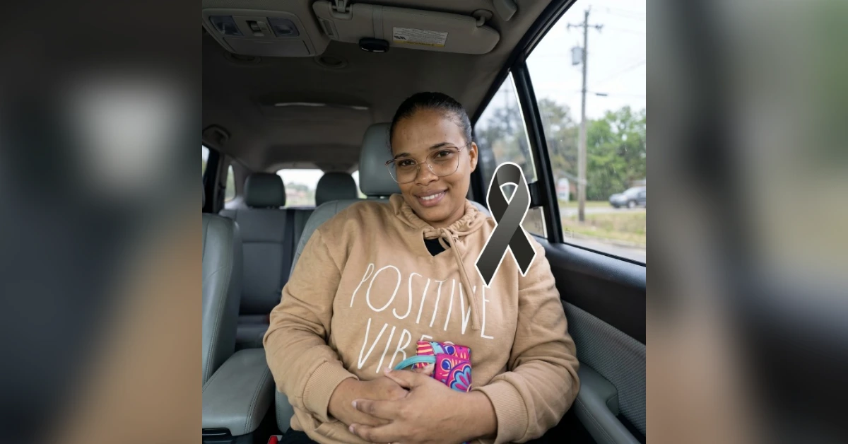 Smiling woman in a car wearing a beige hoodie that says 'POSITIVE VIBES', holding a colorful phone case, with a gray awareness ribbon overlay.