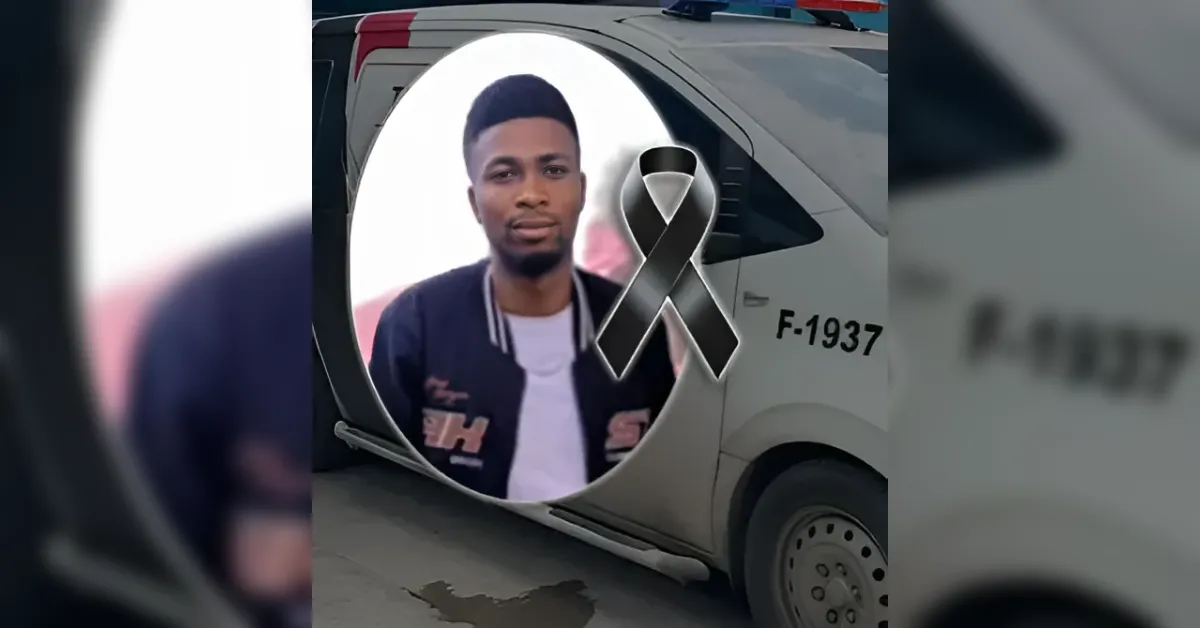 Memorial post on a vehicle showing a man's portrait in a circular frame with a black ribbon symbolizing mourning. The vehicle has 'F-1937' on its side.