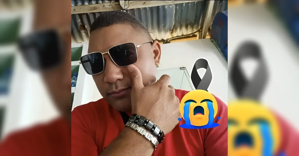 Man in sunglasses wearing a red shirt, touching his cheek in a selfie with a crying-laughing emoji overlay in the foreground.