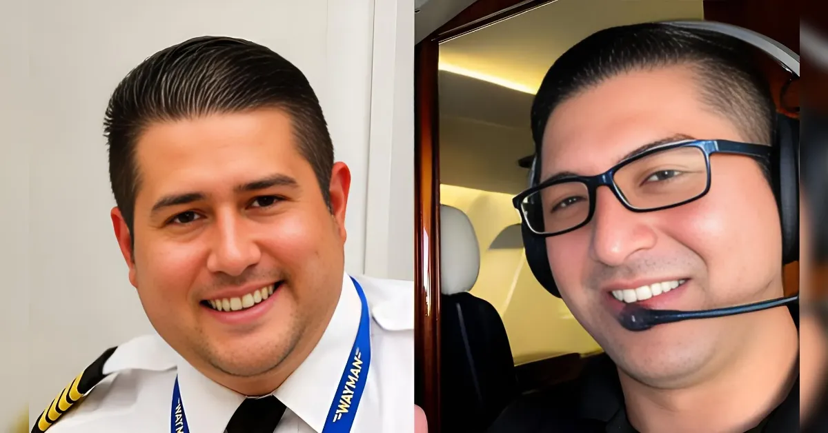 Two men smiling for a photo: a pilot in uniform on the left and another wearing a headset in an airplane cockpit on the right.