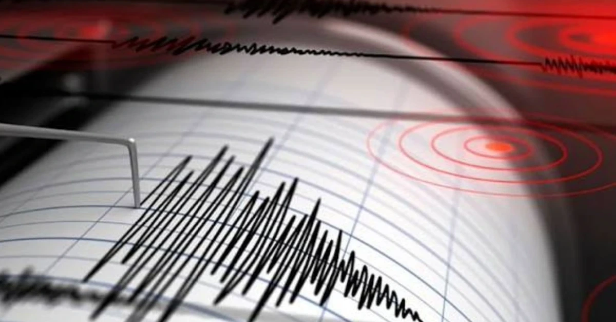 Close-up of an ECG trace on graph paper with red circular radar graphics in the background.
