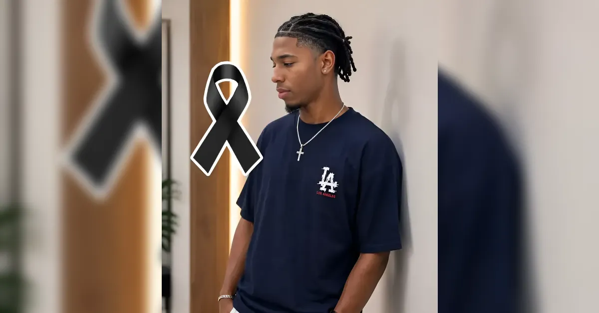 Young man in a navy LA shirt leans against a wall, with a large black mourning ribbon overlay. Obvious tribute image for remembrance or condolences.