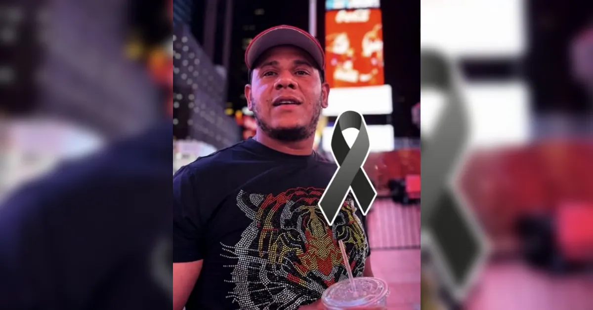 Man wearing a cap at night in a neon city backdrop, with a gray awareness ribbon graphic overlaid on his chest area and holding a drink.
