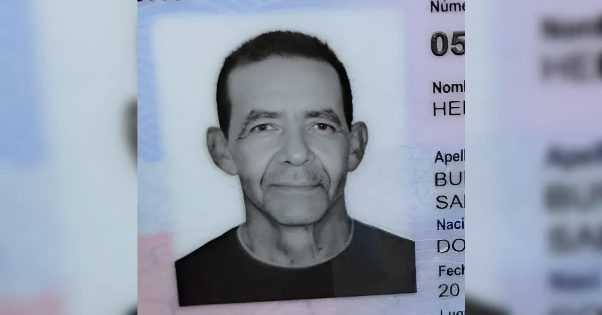 ID card photo of a middle-aged man with short dark hair, facing the camera in a grayscale portrait.