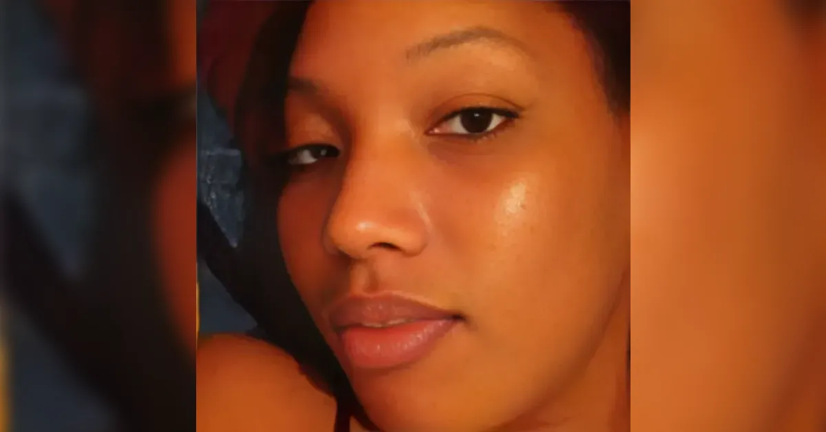 Close-up portrait of a young woman with glowing skin and relaxed expression, looking slightly to the side.