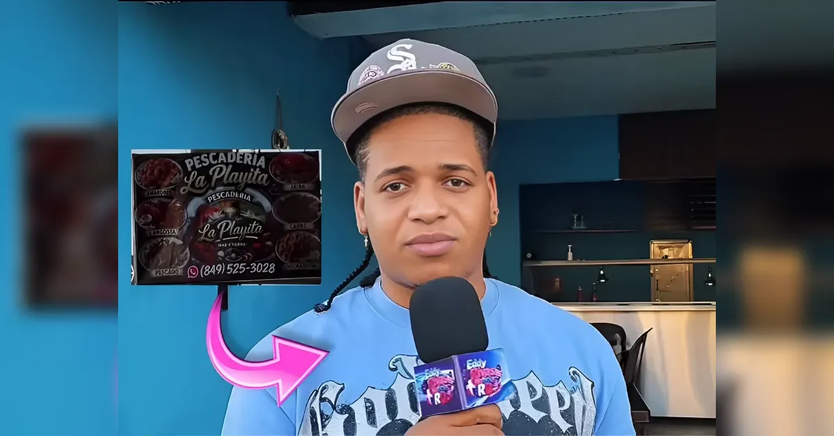Young man wearing a cap speaks to the camera in a blue-tinted room, holding a microphone with a La Playita sign in the background.