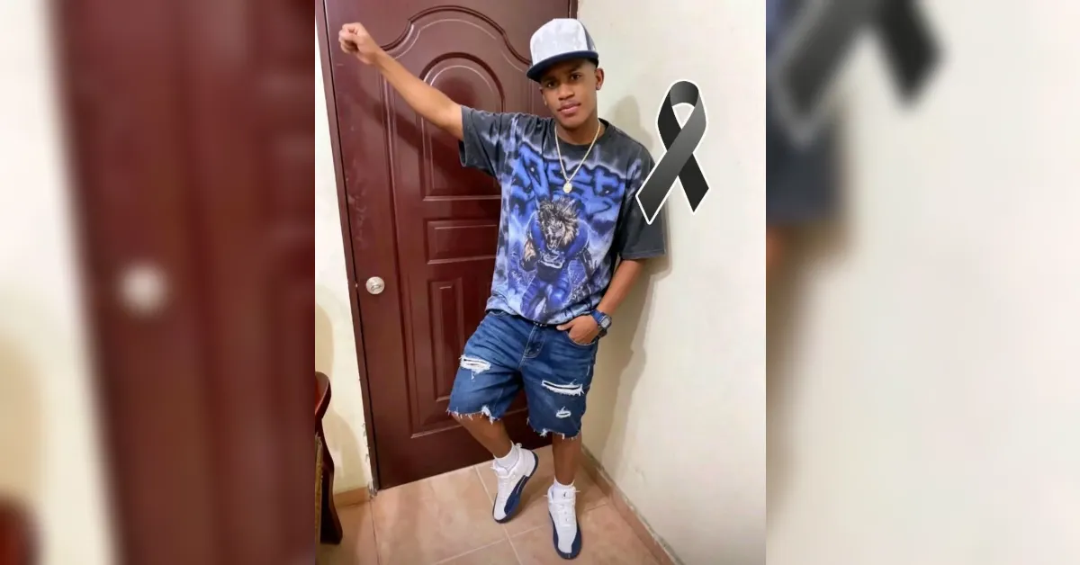 Young man posing in a doorway with a black awareness ribbon beside him.
