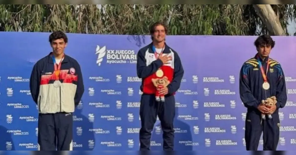 Three medal-winning athletes stand on a podium during a ceremony, holding plush mascots against a purple event backdrop with logos.