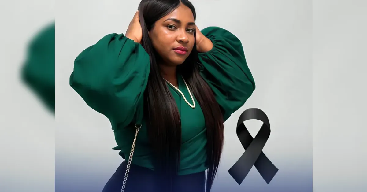 Woman in a green top with voluminous sleeves poses with hands on her head; a black awareness ribbon is visible beside her.