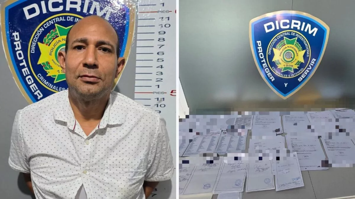 Mugshot of a bald man in a white dotted shirt standing before a height chart and DICRIM police emblem on the wall on the left.