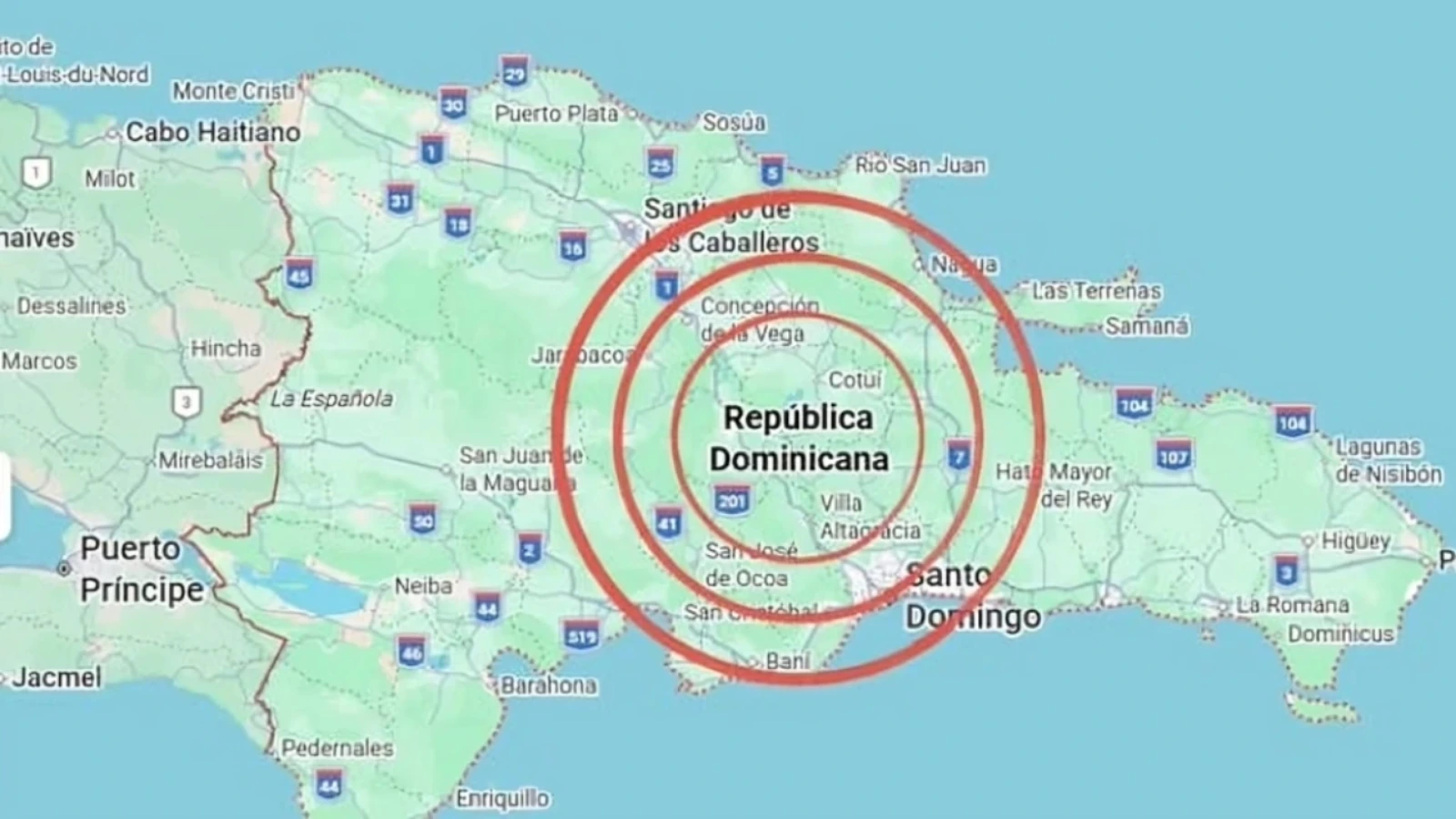 Map of the Dominican Republic showing red concentric circles centered near Santo Domingo to indicate earthquake intensity zones or epicenter area near the capital.